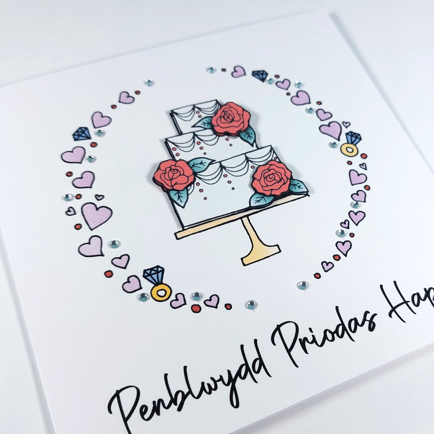 Penblwydd Priodas Hapus Card (Anniversary) Cake Pink Roses - Welsh Card